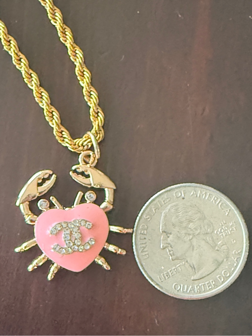 CHANEL Necklace with Pink
Heart CC Crab on new 18” titanium
Twisted rope chain